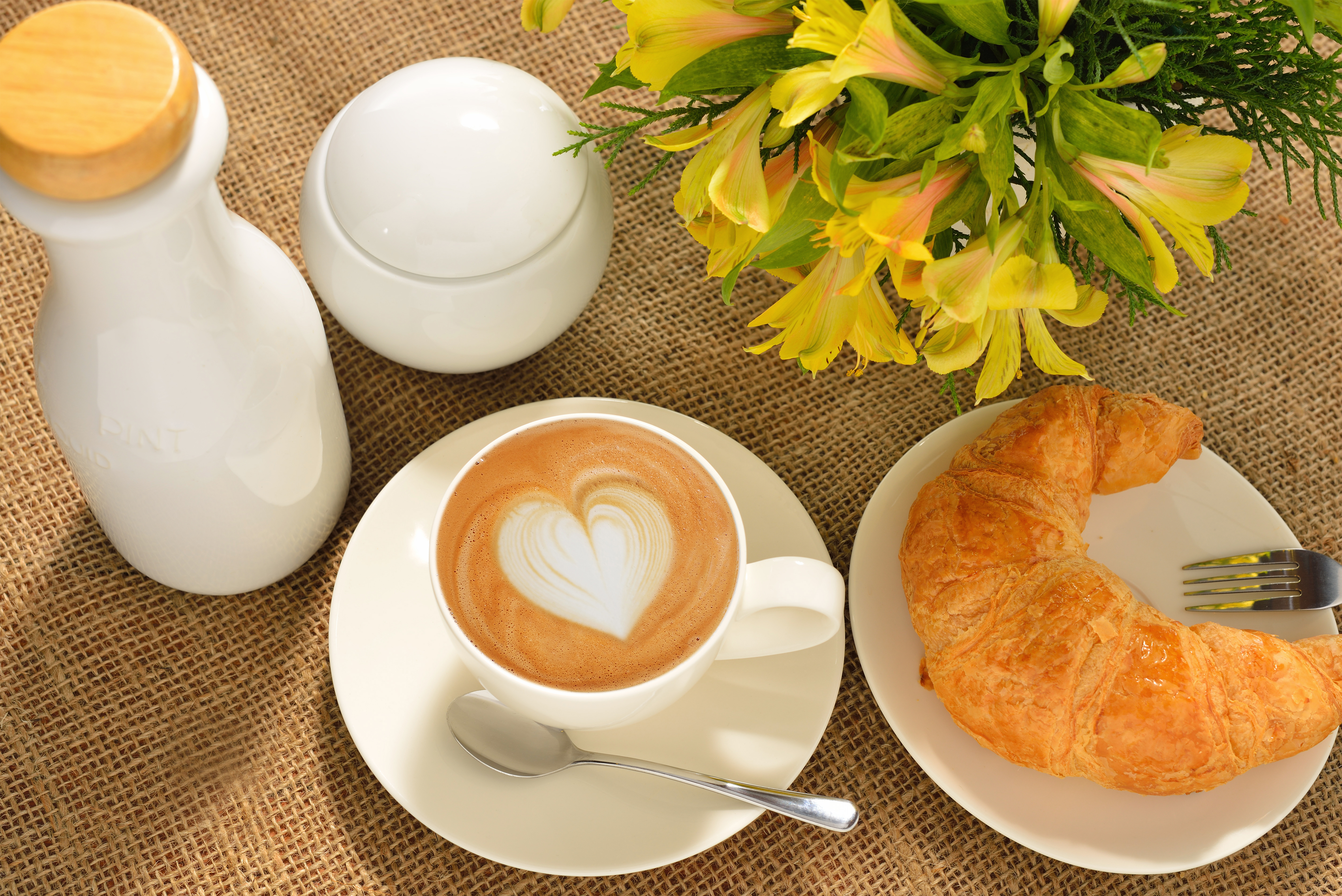 Cup_of_Coffee_Flowers_and_Croissant_Background.jpg