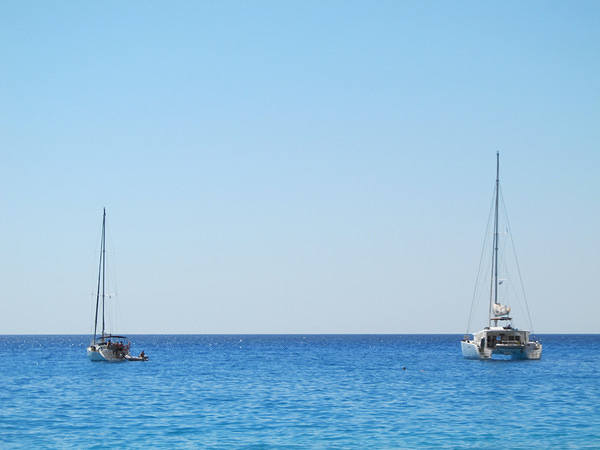 This jpeg image - Two Sailboats in the Sea Background, is available for free download