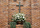 Cross and Flowers Brick Wall Background