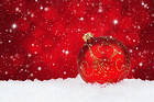 Red Christmas Snowy Background with Christmas Ball