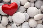 Red Heart and White Stones Background