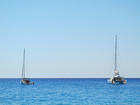 Two Sailboats in the Sea Background