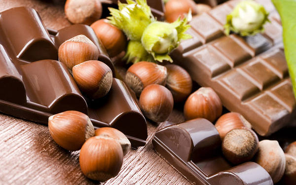 This jpeg image - Chocolate and Hazelnuts Background, is available for free download
