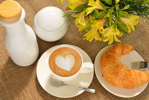 This jpeg image - Cup of Coffee Flowers and Croissant Background, is available for free download