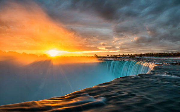 This jpeg image - Sunset Over the Waterfall Wallpaper, is available for free download