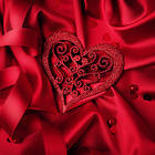Beautiful Heart in Red Satin Background