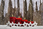 Christmas Snowy Background with Red Candles