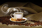 Cup of Coffee Coffee Seeds Cinnamon and Brown Sugar Background