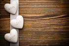 Wooden Background with White Stone Hearts Hope Love Dream
